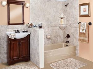 A beautiful remodeled bathroom with marble tile and a tub/shower combo.