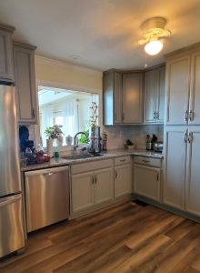 newly remodeled kitchen with grey cabinetry